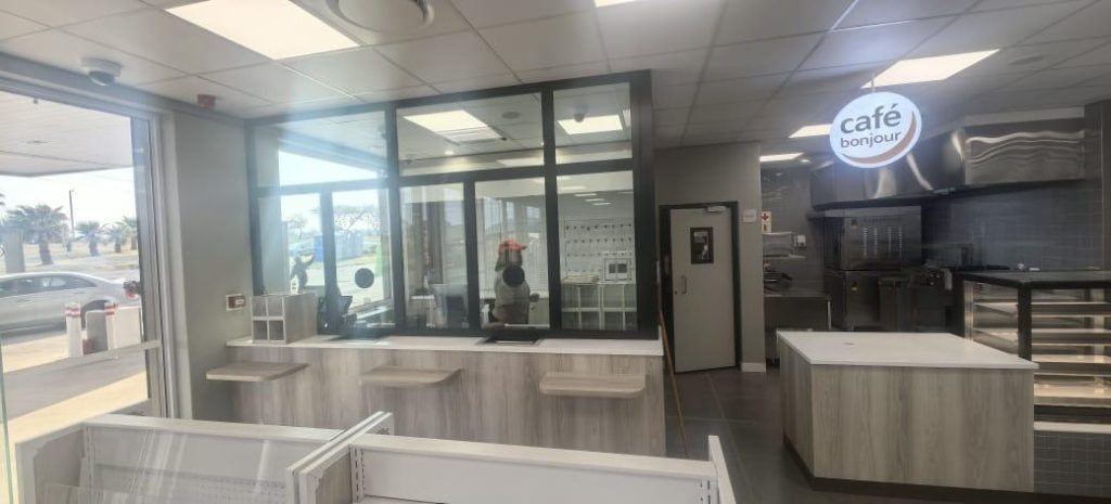 Wide interior shot of the fully refurbished store with upgraded lighting and electrical layouts.