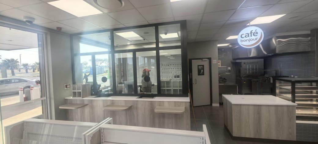 Wide interior shot of the fully refurbished store with upgraded lighting and electrical layouts.