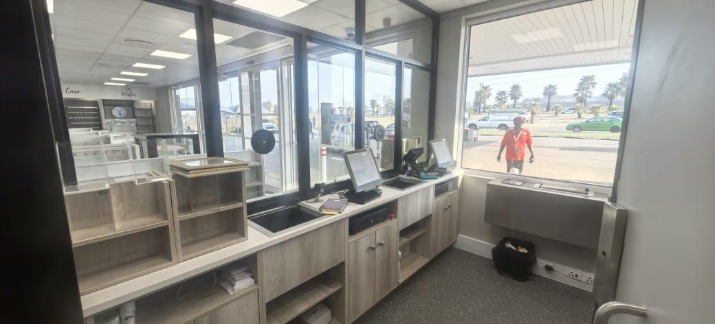 Front counter area with new electrical fittings, lighting, and power points installed by Faradays.