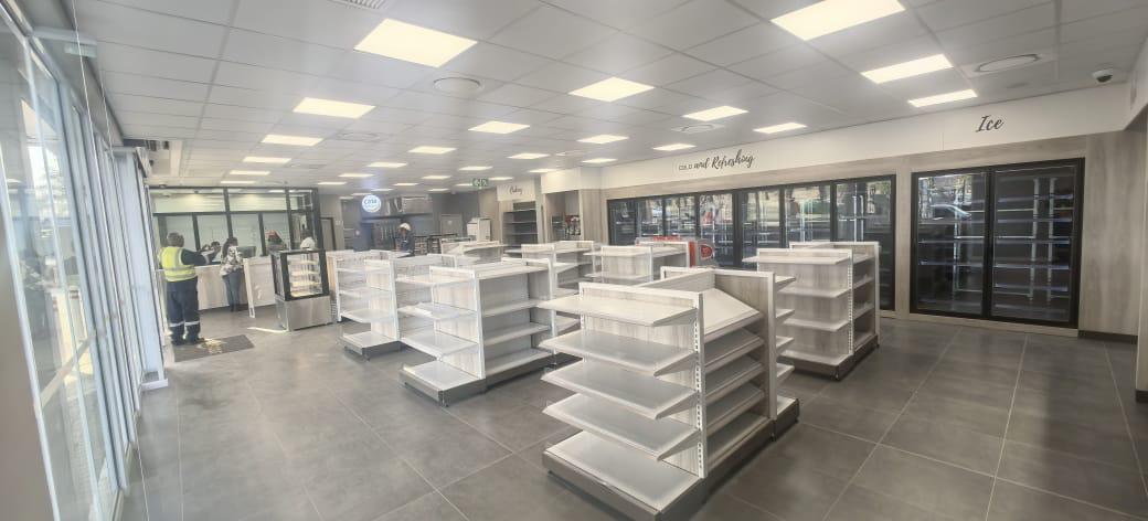 Full view of store shelving and electrical installations after Faradays’ revamp.