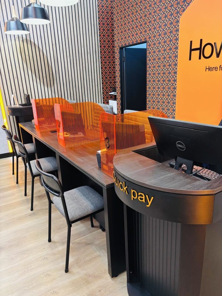 Cell C Galleria Mall store counter area with integrated power points and lighting details.