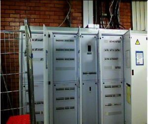 Close-up of electrical distribution board components and wiring.