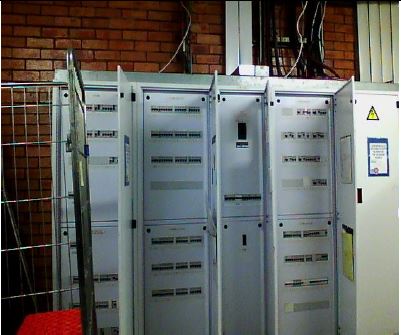 Close-up of electrical distribution board components and wiring.