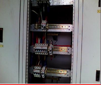 Open electrical distribution board during routine maintenance check.