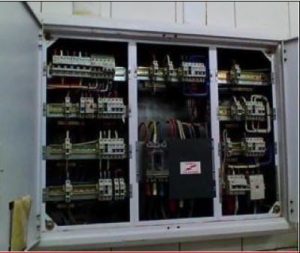 Electrical panel with labelled breakers and organised wiring layout.