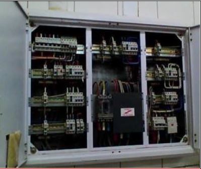 Electrical panel with labelled breakers and organised wiring layout.