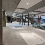 Interior entrance area at The Verge with ceiling lighting and tiled flooring.