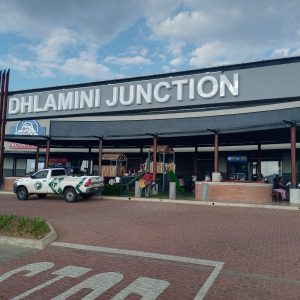 Front view of Dhlamini Junction shopping centre showing main entrance and parking area