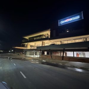 A full night view of The Verge’s front elevation, glowing with completed electrical installations.